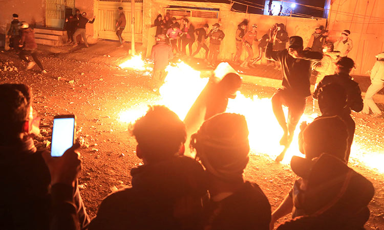 Protesters burn tyres despite Iraqi PM’s vow to quit