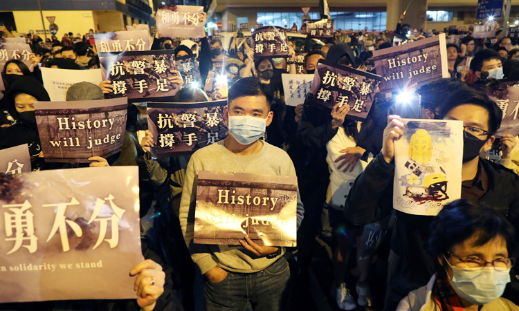 Hong Kong police say suspect fired shot during protest-related arrest