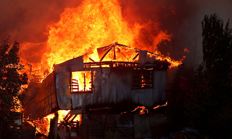 Dozens of homes damaged by wildfire in hills over Chile city