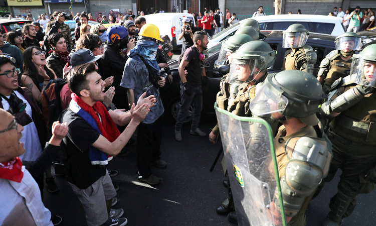 Protesters clash with police as Chile unrest enters 50th day