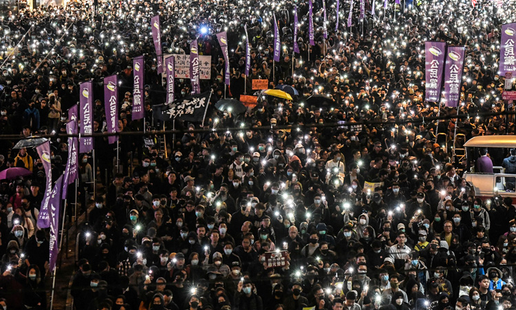 Peaceful Hong Kong march marred by fire outside court, police say