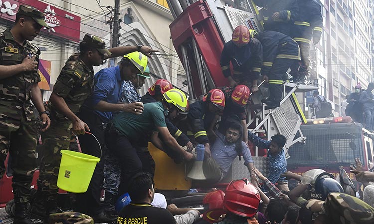 Workers jump to their deaths as Dhaka office block fire kills 19