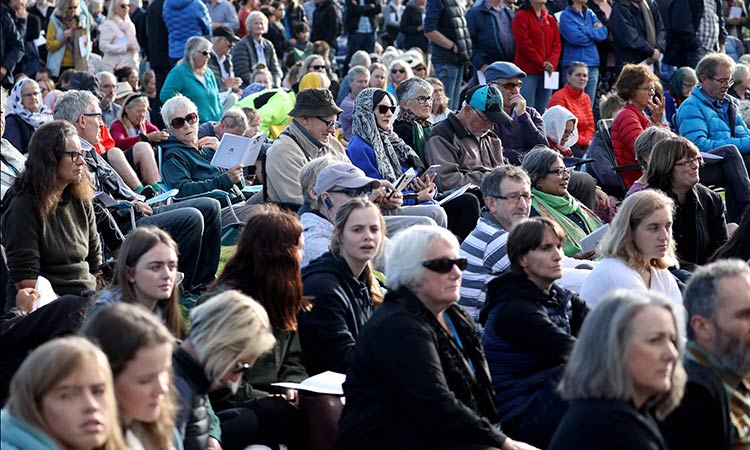 Silent crowd listens to mosque victims' names at New Zealand memorial