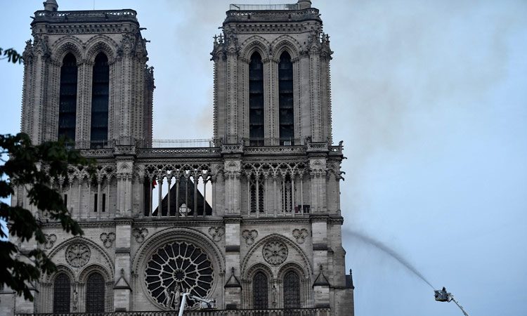 Notre-Dame fire under control, Macron vows to rebuild