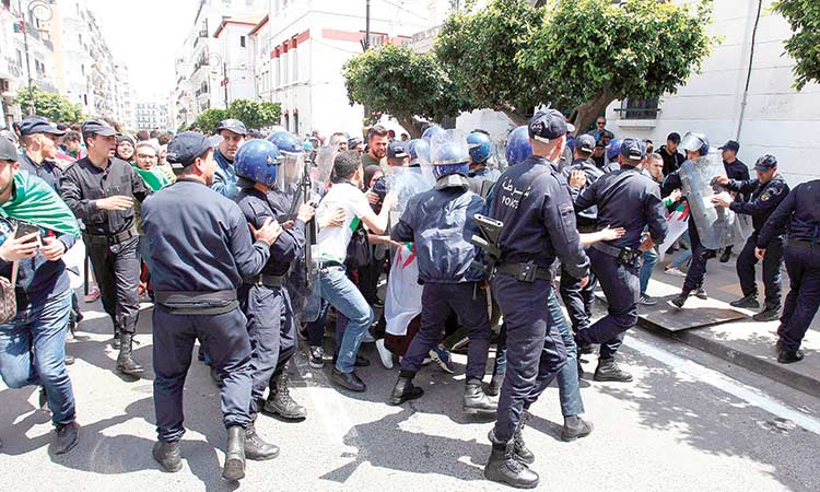 Algeria top official quits as protests go on