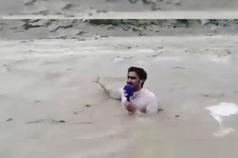 Watch how a Pakistani TV journalist reports on floods, submerged in water