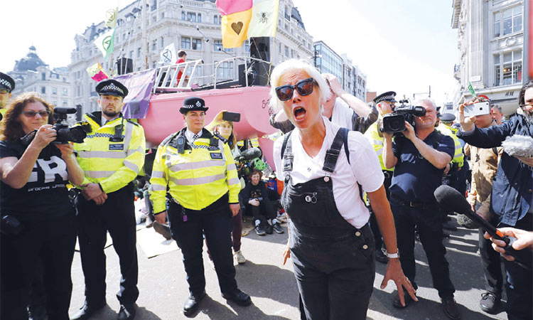 Film star, weeping teenagers  join climate protest in London