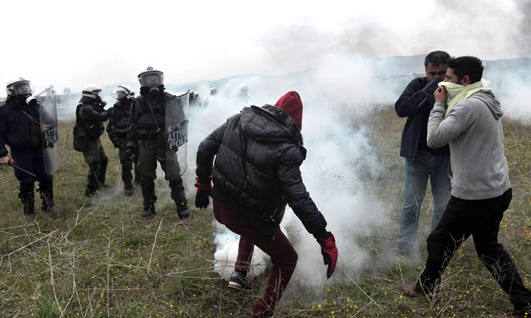 Clashes erupt as Greek police stop migrants from reaching border