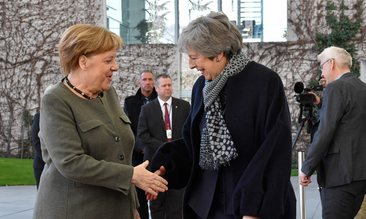 May heads to France after asking Merkel to help on the Brexit impasse