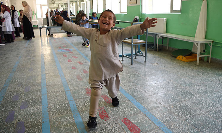 Watch young Afghan amputee's joy at dancing on new leg 