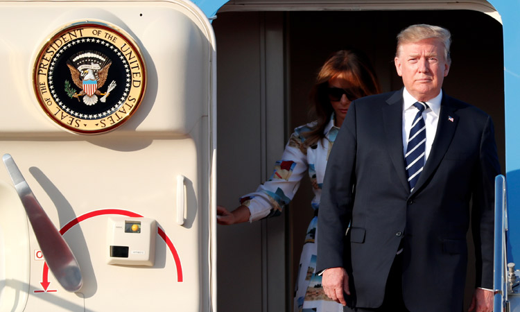 Trump arrives for sumo summit with Abe