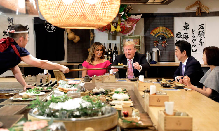 Trump, Abe bond over burgers, sumo and golf