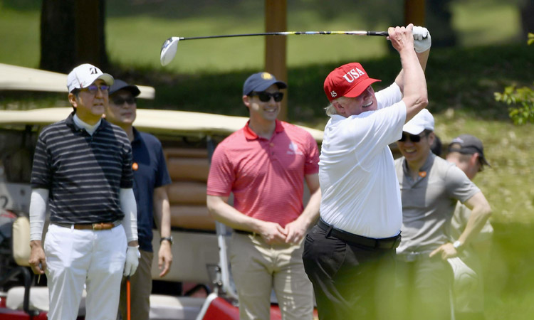 Trump tees up Japan summit with Abe golf match