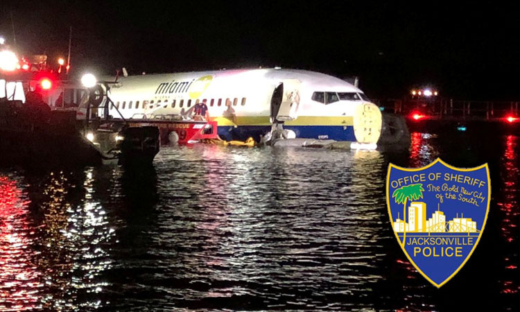 Boeing 737 slides off runway into Florida river, 21 hurt