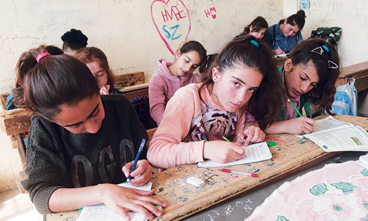 Syrian Kurds reshape region with books and schools