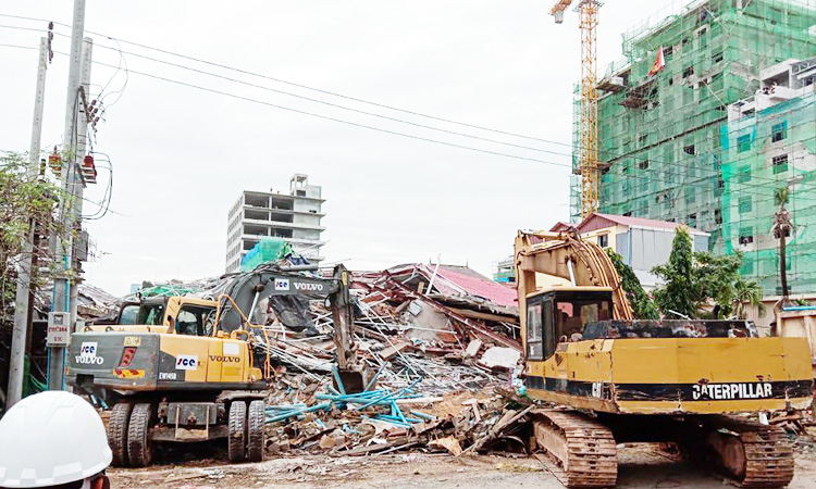 Three dead, dozens feared buried in Cambodia building collapse