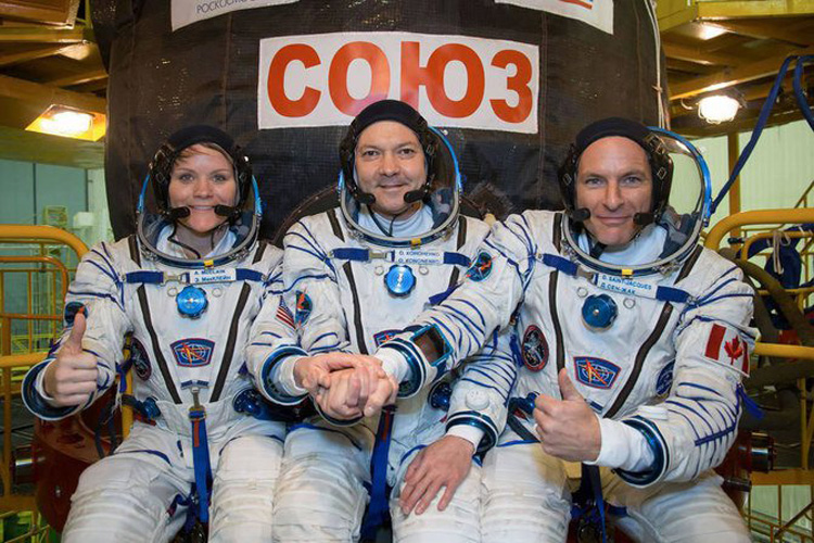 Russian, North American astronauts return to earth