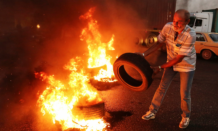 Lebanese army veterans block highways to protest budget cuts