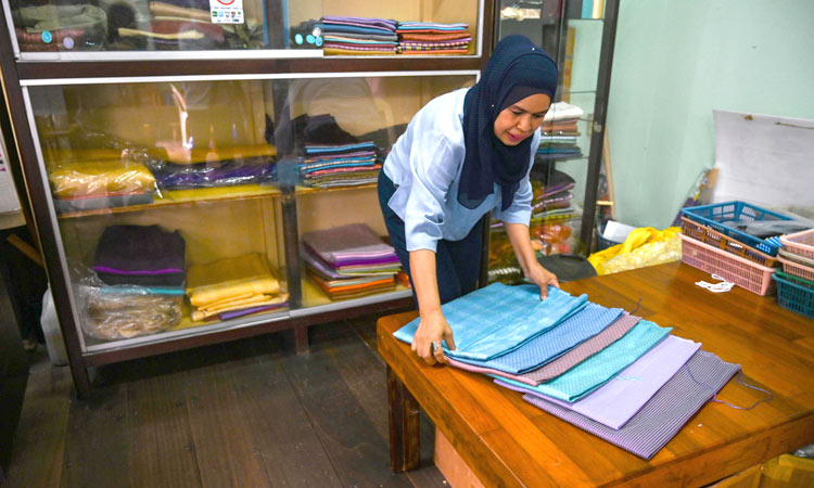 By a thread: Thai Muslim family keeps silk weaving heritage alive