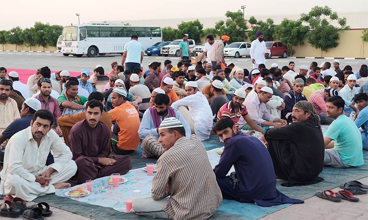 Blue-collar workers enjoy Iftar meal