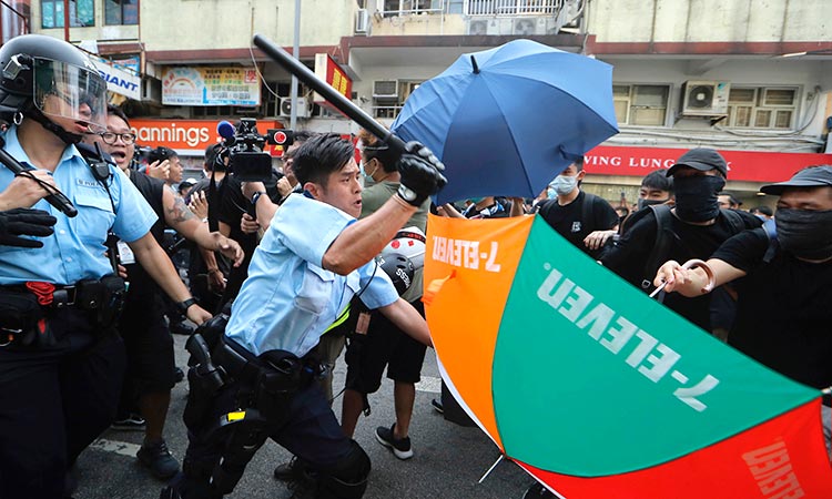 Clashes as Hong Kong protesters vent at China border traders