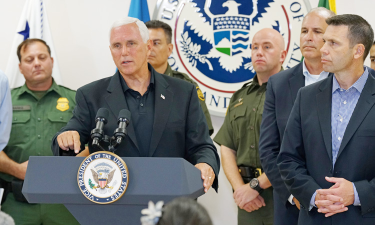 US VP Pence visits overcrowded migrant camp, deplores ‘crisis’