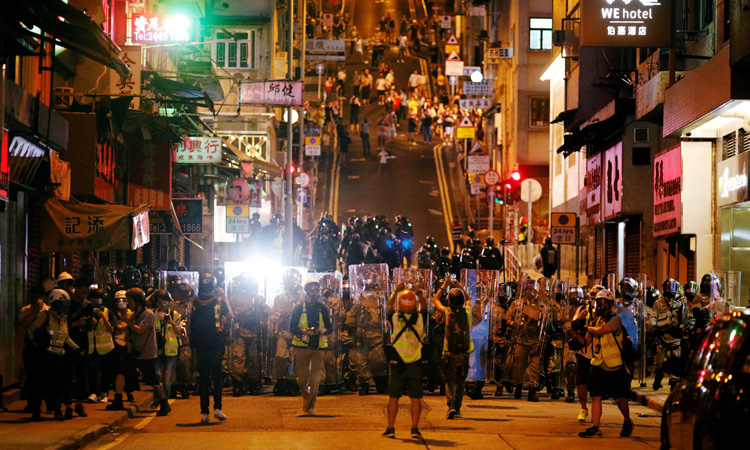 After weekend of violent clashes, Beijing to address Hong Kong unrest