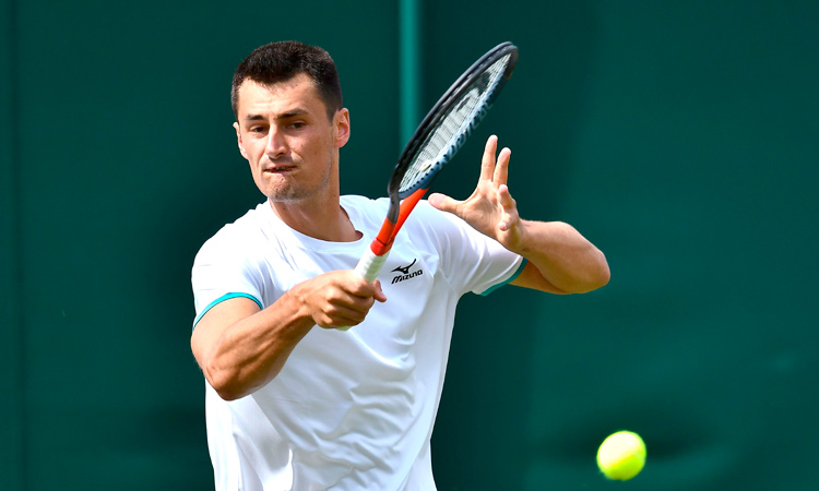 Tomic ‘the tank engine’ sputters in 58 minutes