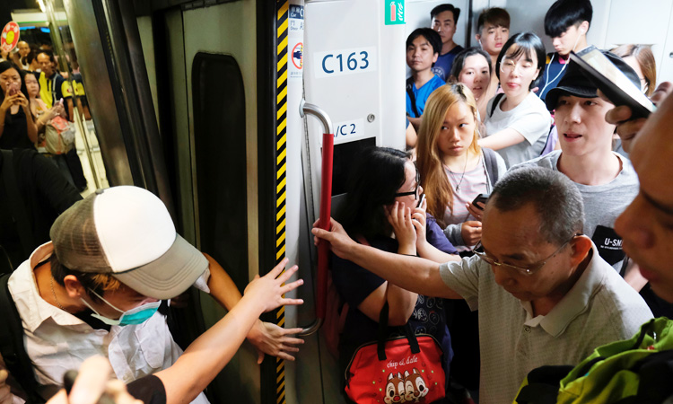 Hong Kong protesters disrupt train services, cause commuter chaos