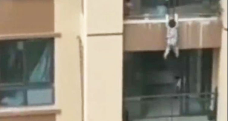 Video:  Chinese toddler falls six storeys, caught by residents 