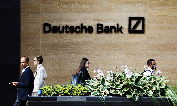 Deutsche Bank shares rise as 18,000 global job cuts begin