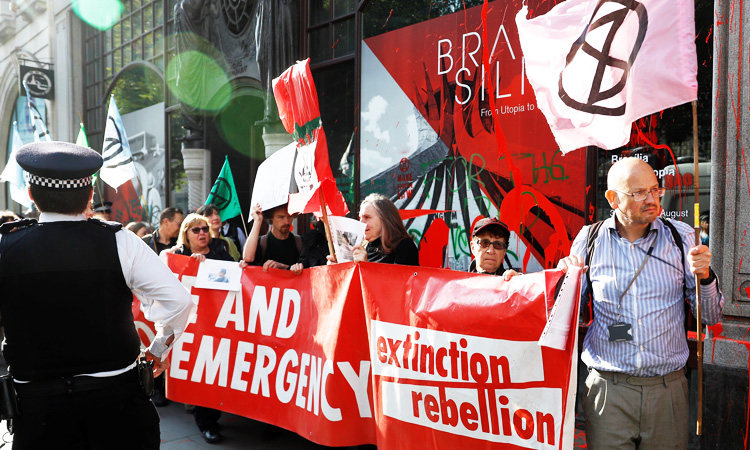 London climate change protesters daub Brazilian embassy blood red