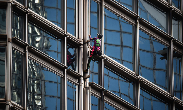 ‘French Spiderman’ scales Hong Kong skyscraper with ‘peace banner’