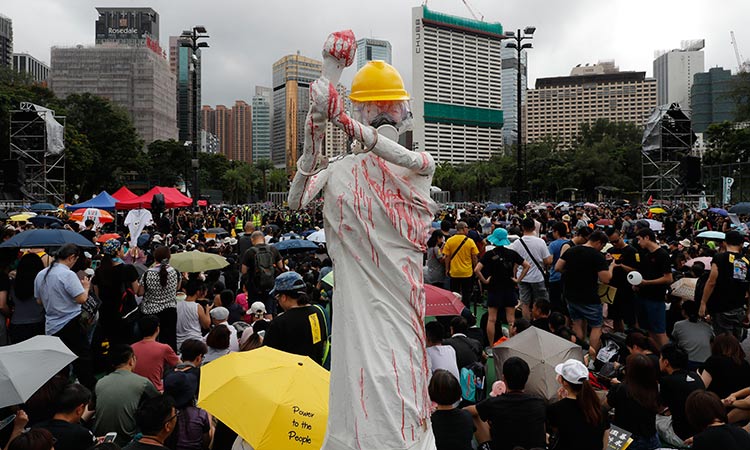 Hong Kong protesters rally to show ‘peaceful’ credentials after chaos