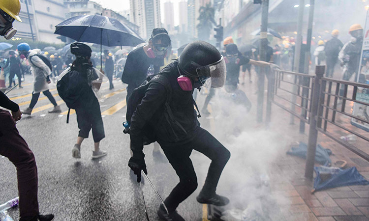 Hong Kong police use tear gas to try to disperse protests