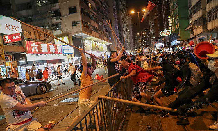 Hong Kong protesters, opponents battle in old communist stronghold