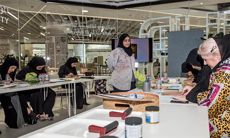 Emirati women learn burqa printing