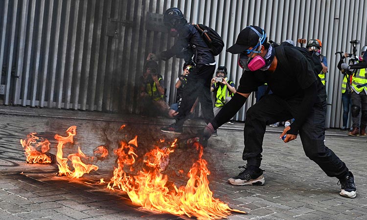 Hong Kong police fire tear gas, water cannon at protesters