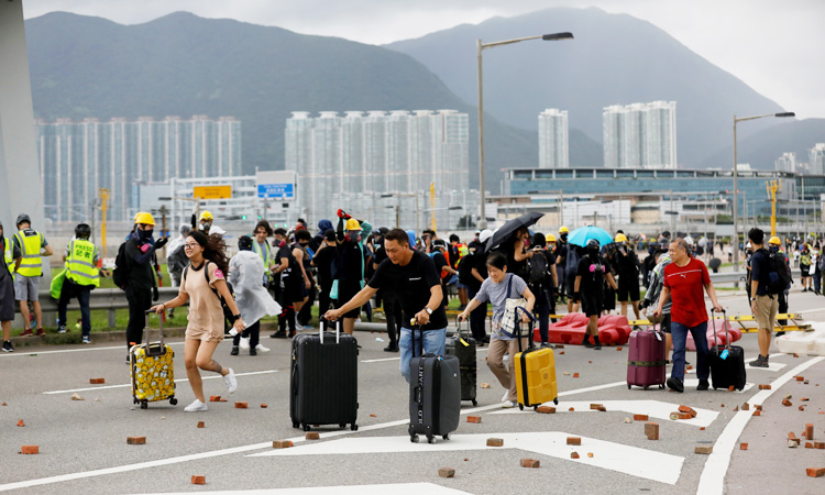 Hong Kong on edge after weekend of clashes, airport disruption