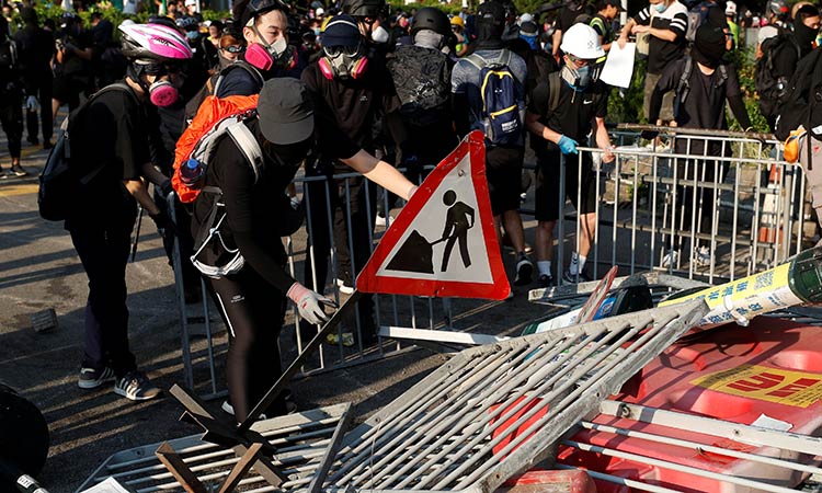 Hong Kong police fire tear gas to try to disperse protesters