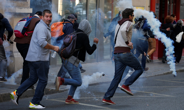 Police use tear gas in Paris amid an array of protests