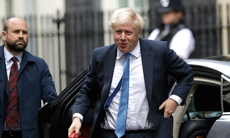 Johnson flies back to face UK parliament as Brexit chaos deepens