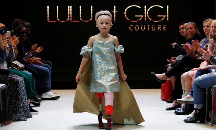 Double amputee girl aged 9 debuts on Paris fashion catwalk