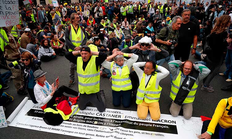 French police break up yellow vest protest with tear gas