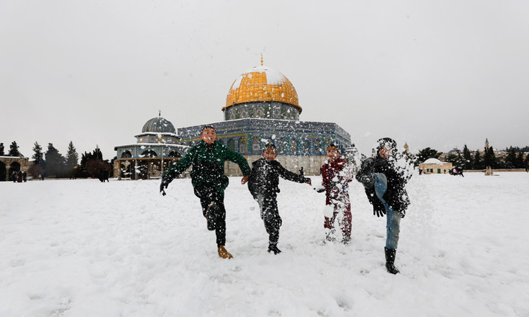 Jerusalem's holy sites and West Bank carpeted in rare snow