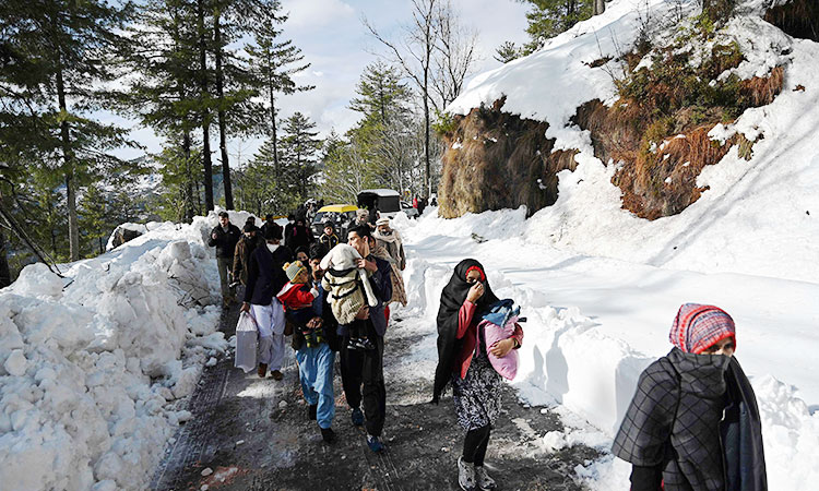 Major roads cleared as rescue operation continues after deadly blizzard in Pakistan's hill resort  