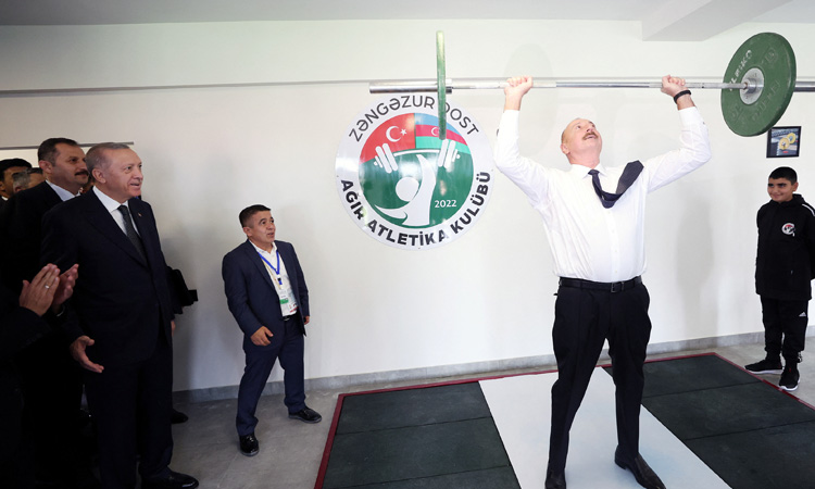 VIDEO: Azerbaijan President Aliyev lifts 20kg barbell after Erdogan jokes at sports centre