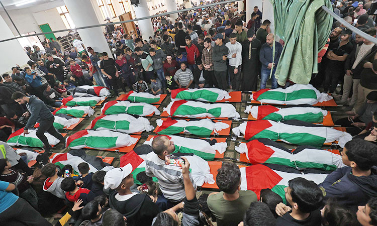 VIDEO: Mourners flood streets at funeral of 21 Gaza apartment blaze victims 