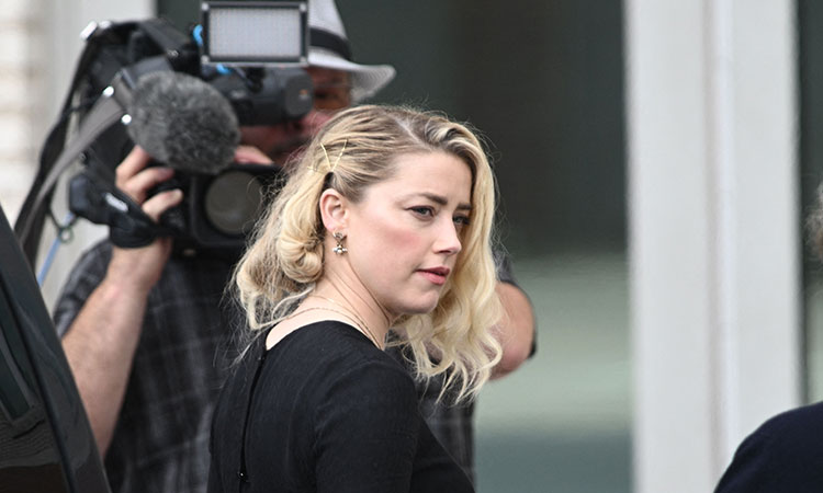 Amber Heard settles defamation case with ex-husband Johnny Depp