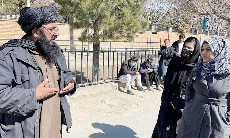 Afghan students return to classes as universities reopen for first time since Taliban takeover